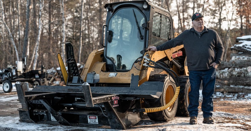 Halverson 150 firewood processor on a CAT skid steer with operator